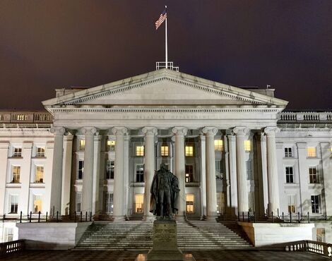 The Treasury Building in Washington, D.C., with the statue of Albert Gallatin in the foreground.