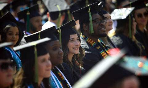 Graduates in regalia at commencement