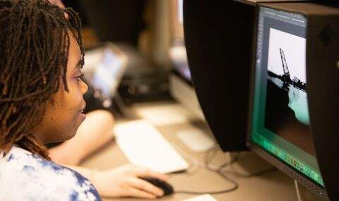 a student working in the BSU Art Center computer lab