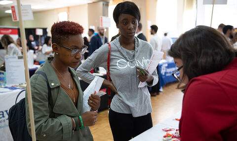 Two students at an internship fair