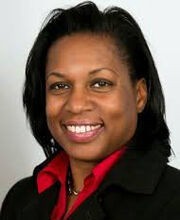 headshot photo of professor Katrina Huff-Larmond smiling with medium length straight black hair and wearing a red button down shirt under a black blazer