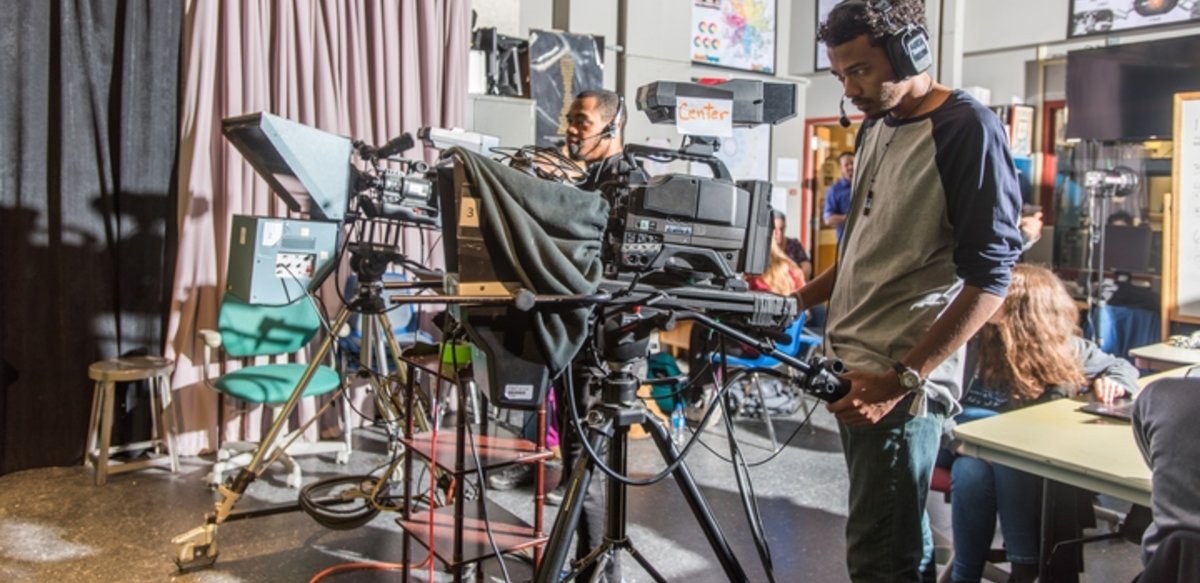 Two students working television cameras. Two students working television cameras.