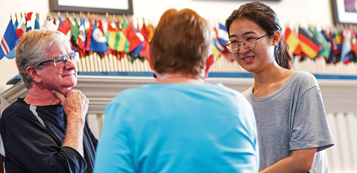 In conversation with international student Yi Wei Huang (right) are Steve Black and Barbara Black.