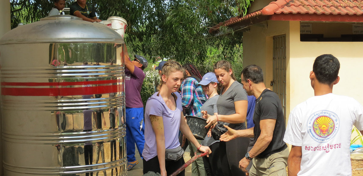BSU students install a large water filter in Cambodia