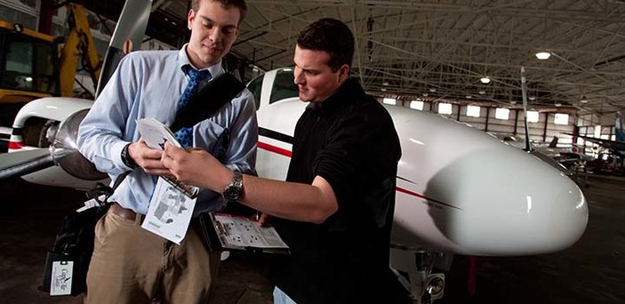An aviation student and instructor go over last minute instrutions