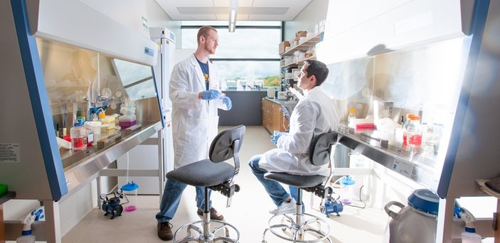 students working in a high tech biology lab