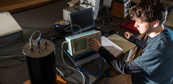 student working with equipment in class student working with equipment in class