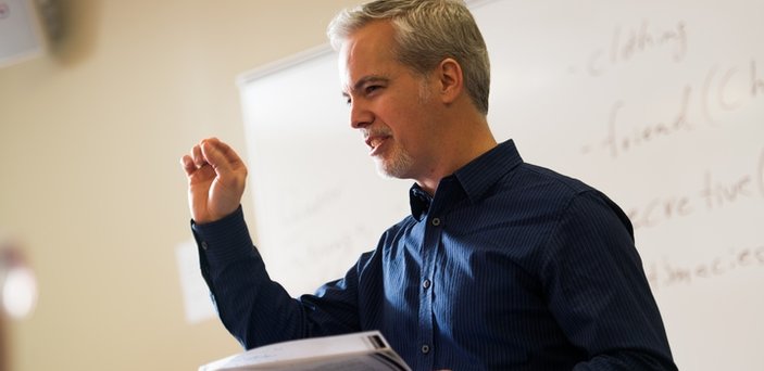 Professor Matt Bell teaching in front of a white board