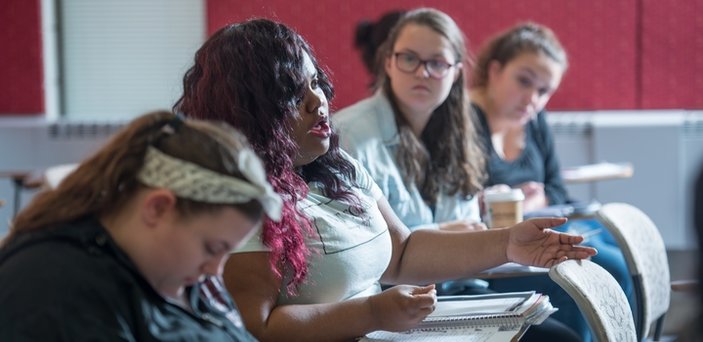 Students listening and participating in class
