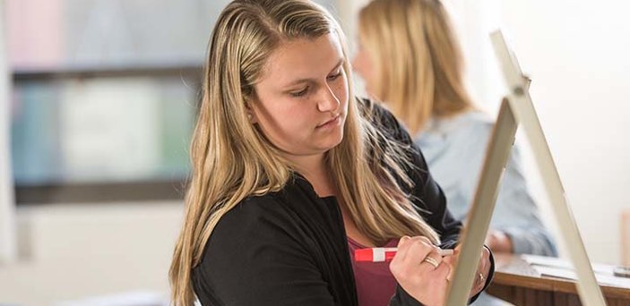 Student prepares class presentation