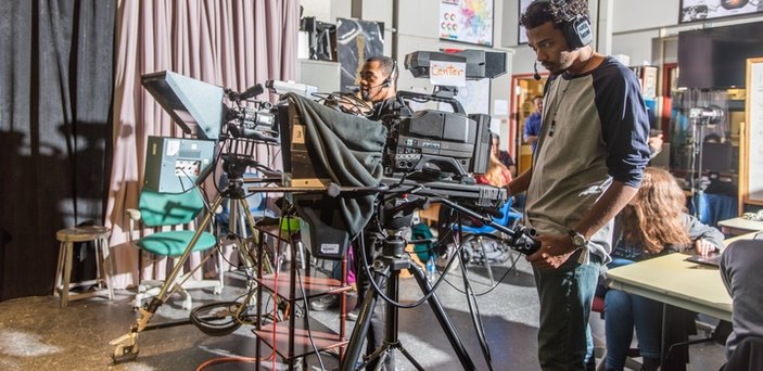 Two students working television cameras.