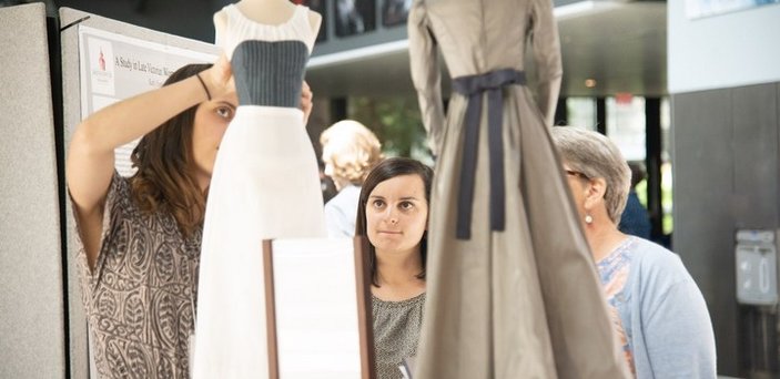 BSU student presenting research on Late Victorian women's fashion at symposium
