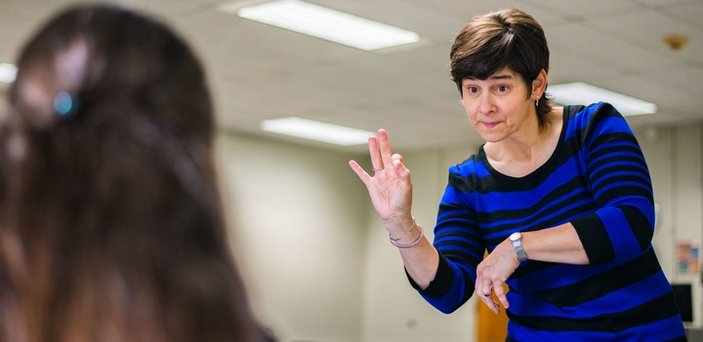 Professor Glenna Caliendo teaching American Sign Language