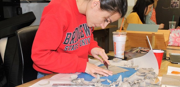 A student works in the book arts program.