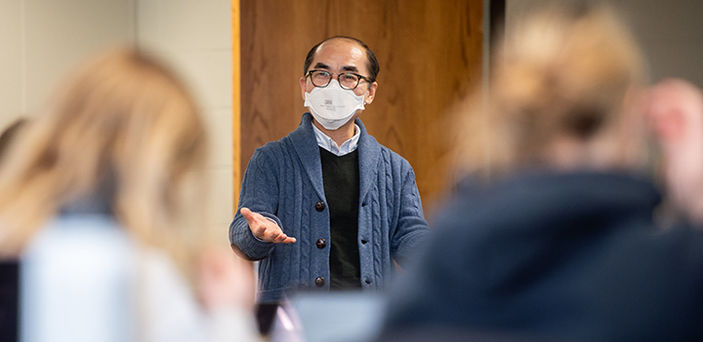 Professor Jonghyun Lee teaching while students look on