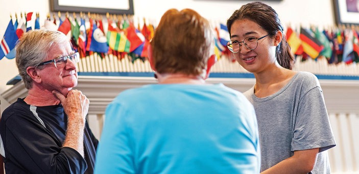 In conversation with international student Yi Wei Huang (right) are Steve Black and Barbara Black.