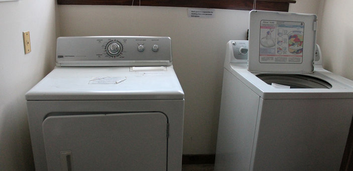 Scholar House laundry room with washing machine and dryer