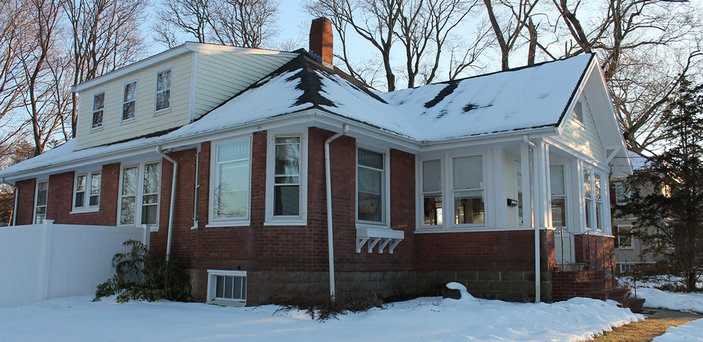 International Scholar House side view with snow on the ground