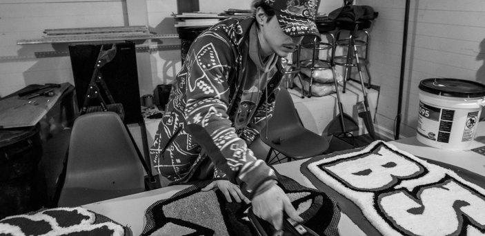 Matt works on creating a rug