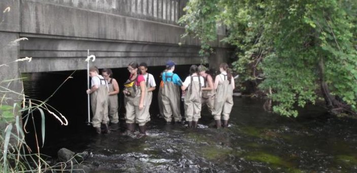Students exploring the river