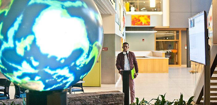 A student using BSU's iglobe in the DMF Science and Mathematics building  