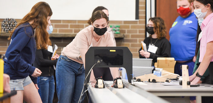 BSU students work with mini racing cars.