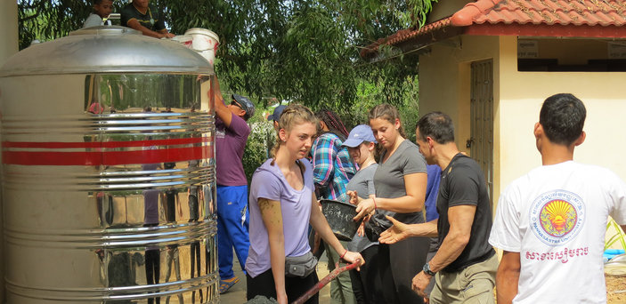 BSU students install a large water filter in Cambodia