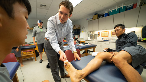 Athletic trainers with patient