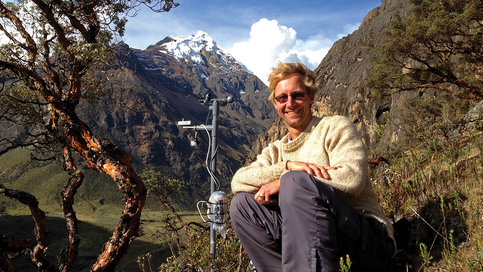 Professor Robert Hellström Sits next to measuring gear on a mountain
