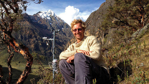 Professor Robert Hellström Sits next to measuring gear on a mountain