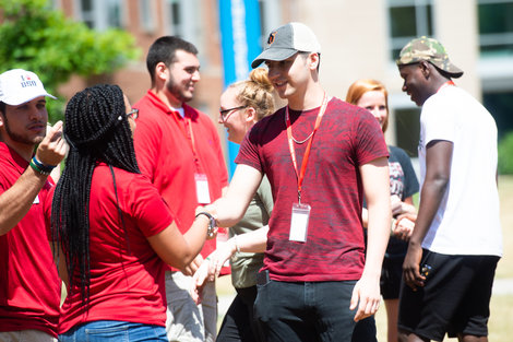 Students greet each other during orientation Students greet each other during orientation