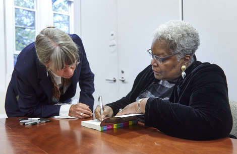 Dr. Ann DuCille, right, signs a book at a recent event Dr. Ann DuCille, right, signs a book at a recent event