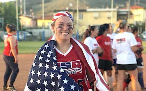 Courtney Banzi, ’19, draped in the American flag Courtney Banzi, ’19, draped in the American flag