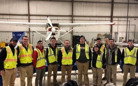 BSU Flight Team in front of plane in a hangar BSU Flight Team in front of plane in a hangar