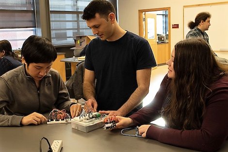 The computer science fellows work with a project. The computer science fellows work with a project.