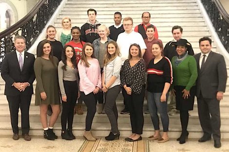 Group of students at statehouse with lawmakers Group of students at statehouse with lawmakers