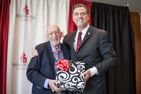 Dr. Joel Litvin receives a retirement gift from President Fr Dr. Joel Litvin receives a retirement gift from President Fr
