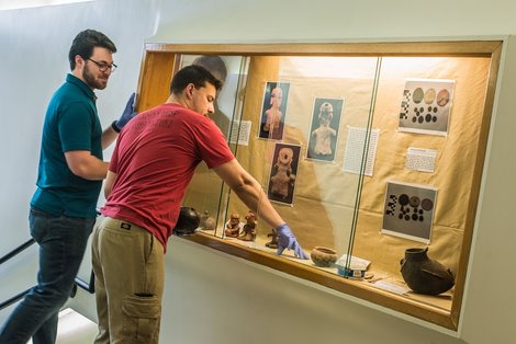 Seniors Jacob Coffey and Scott Delaney set up the exhibit in Seniors Jacob Coffey and Scott Delaney set up the exhibit in
