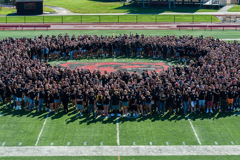 New students pose for a photo on Swenson Field. New students pose for a photo on Swenson Field.