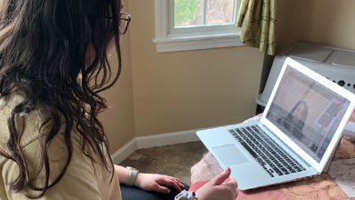 An AAC mentor works with mentee online
