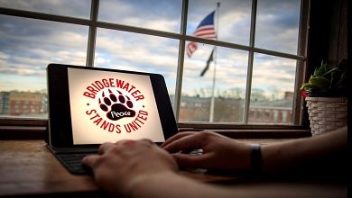 Person at computer looking at BSU Stands United logo