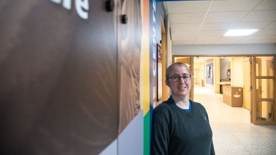 Carolyn Daggart, Pride Center Director standing in hallway
