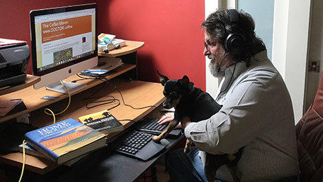 Dr. James Hayes-Bohanan teaches a class from him home.
