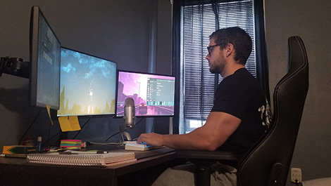 Christian Cabral works at his computer.