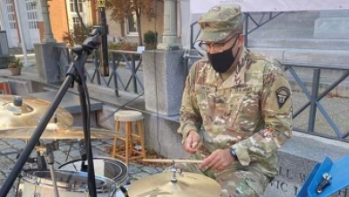 Jordan Snow plays drums in uniform
