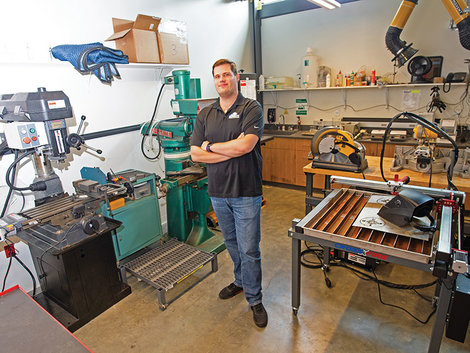 Robert Monteith, analytical instrumentation engineer, stands inside the Academic Machine Shop.