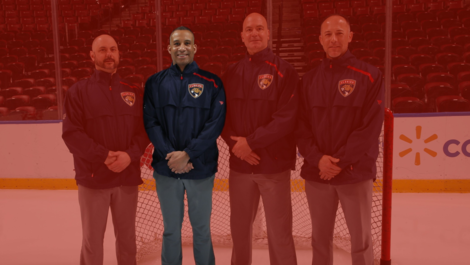 Mike Valcy, '01, poses on the ice as a massage therapist for the Florida Panthers
