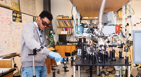 A student demonstrates photonics