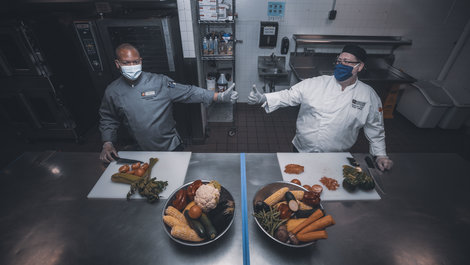 Chefs working in the six foot kitchen