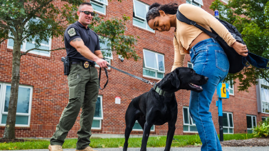 Ryan Tepper with K-9 Zach and a student